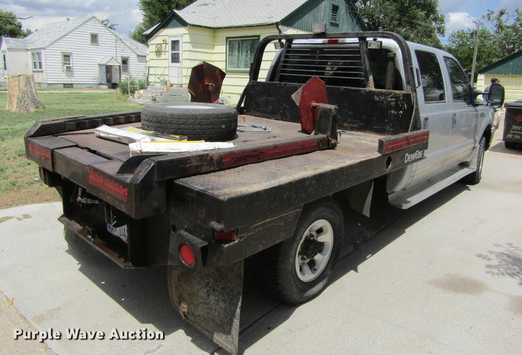 image for item DD5753 1999 Ford F350 Super Duty XLT Crew Cab bale bed pickup truck