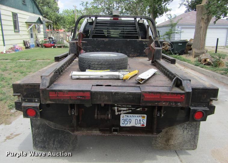 image for item DD5753 1999 Ford F350 Super Duty XLT Crew Cab bale bed pickup truck