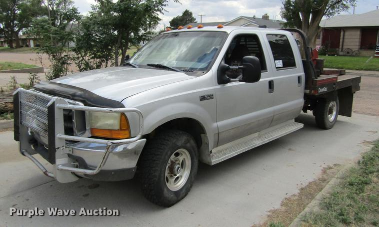 image for item DD5753 1999 Ford F350 Super Duty XLT Crew Cab bale bed pickup truck