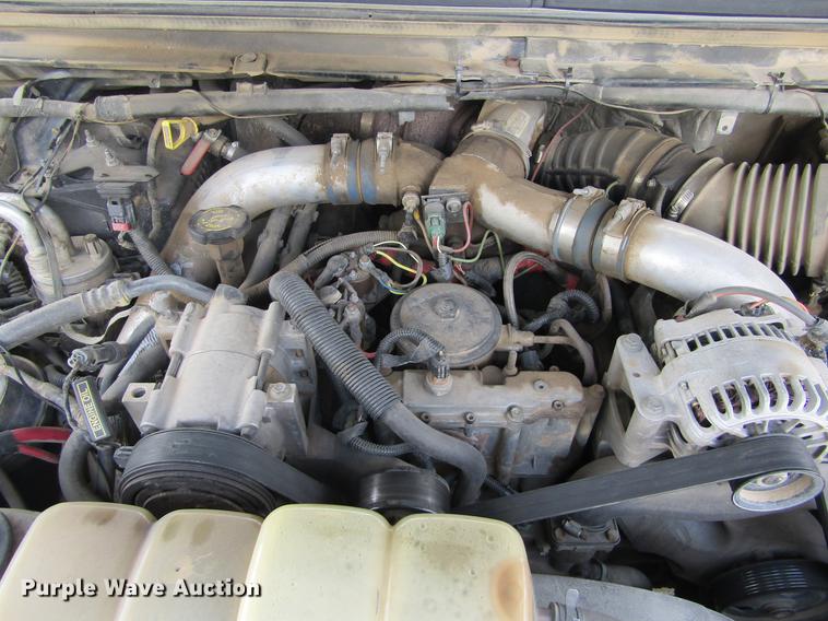 image for item DD5753 1999 Ford F350 Super Duty XLT Crew Cab bale bed pickup truck