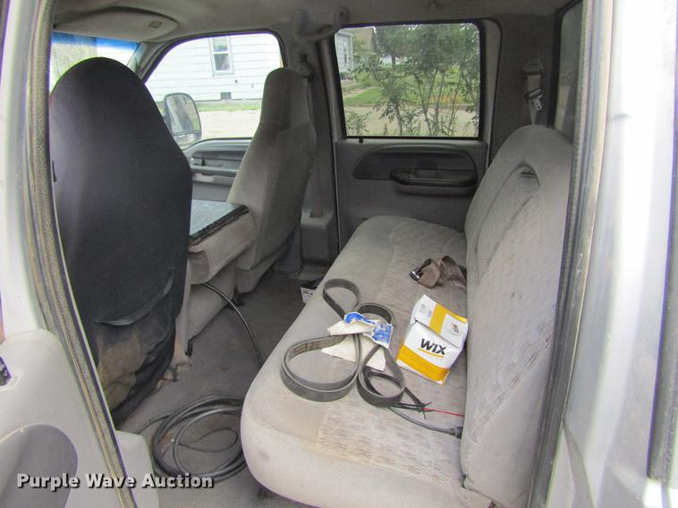 image for item DD5753 1999 Ford F350 Super Duty XLT Crew Cab bale bed pickup truck