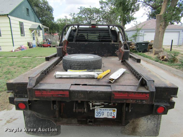 image for item DD5753 1999 Ford F350 Super Duty XLT Crew Cab bale bed pickup truck