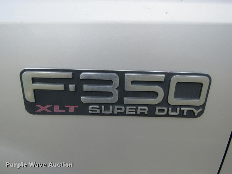 image for item DD5753 1999 Ford F350 Super Duty XLT Crew Cab bale bed pickup truck