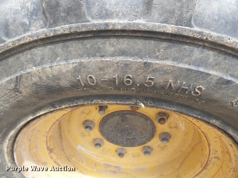 image for item DB7111 1999 John Deere 250 skid steer