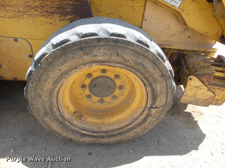 image for item DB7111 1999 John Deere 250 skid steer