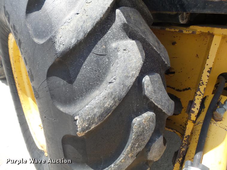 image for item DD7248 2000 John Deere 310SE backhoe