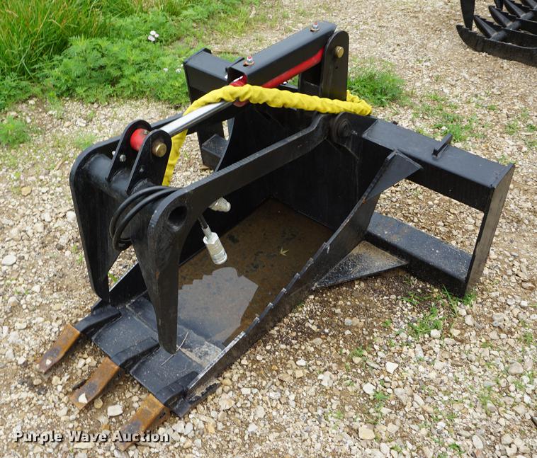 image for item DD7703 Stump bucket with grapple skid steer attachment