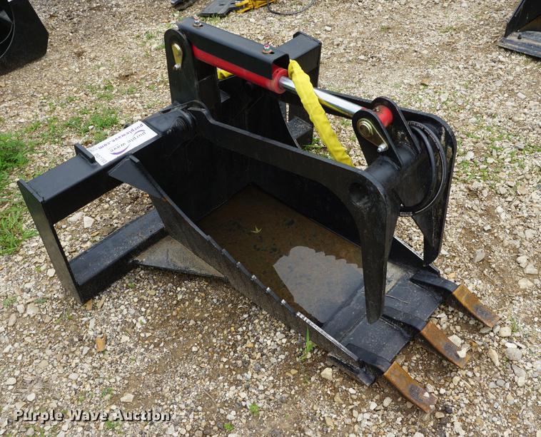image for item DD7703 Stump bucket with grapple skid steer attachment