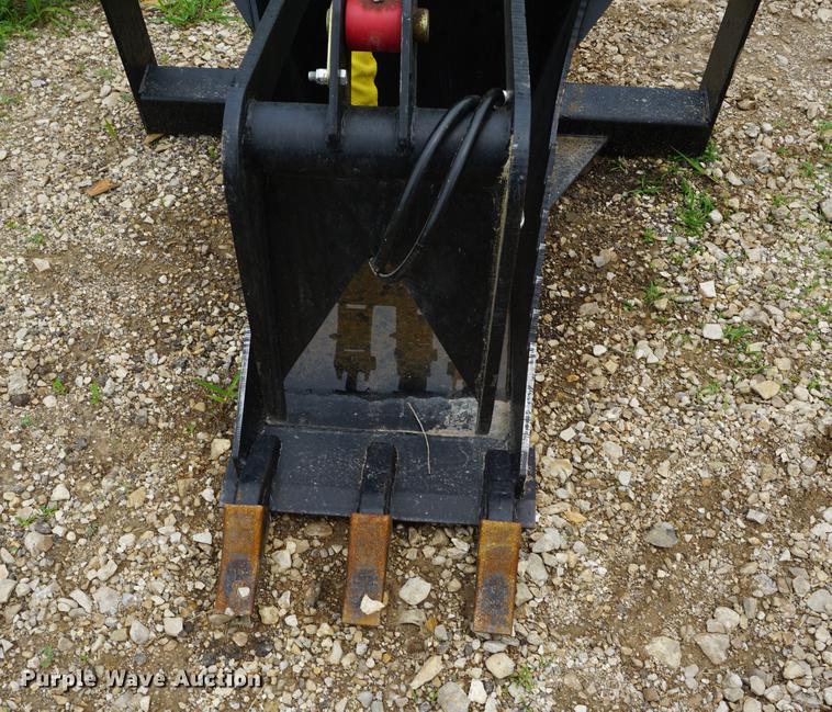 image for item DD7703 Stump bucket with grapple skid steer attachment