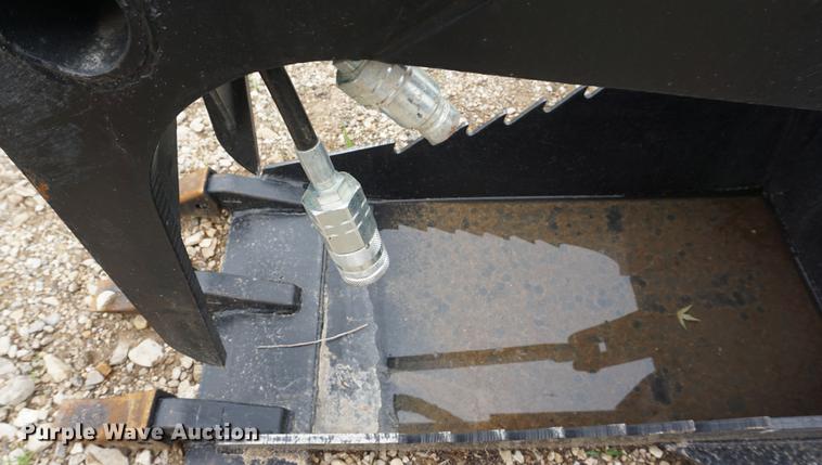 image for item DD7703 Stump bucket with grapple skid steer attachment