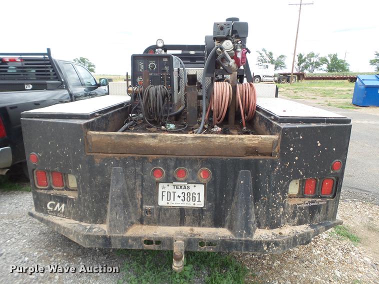 image for item DD1164 2014 Dodge Ram 5500 Crew Cab flatbed truck