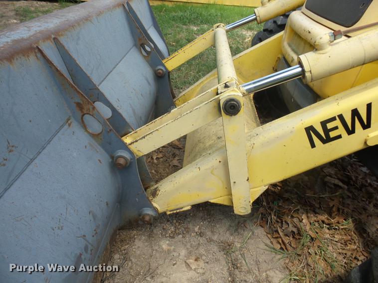 image for item K6269 New Holland 555E backhoe
