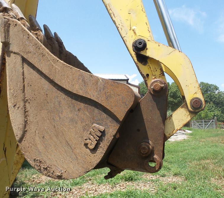image for item K6269 New Holland 555E backhoe