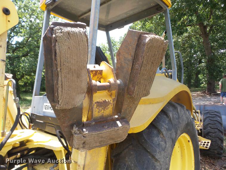 image for item K6269 New Holland 555E backhoe