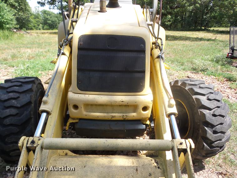 image for item K6269 New Holland 555E backhoe