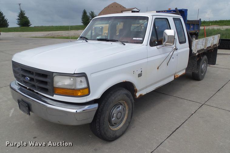 image for item DZ9380 1992 Ford F250 SuperCab flatbed pickup truck