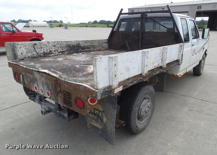 image for item DZ9380 1992 Ford F250 SuperCab flatbed pickup truck
