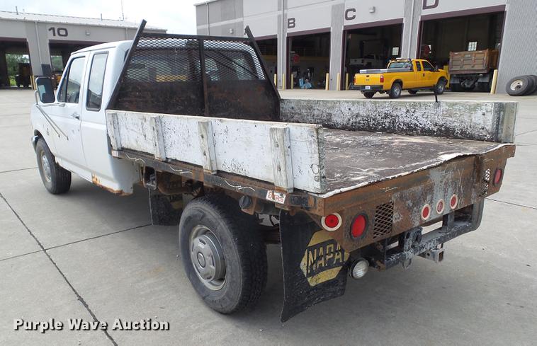 image for item DZ9380 1992 Ford F250 SuperCab flatbed pickup truck