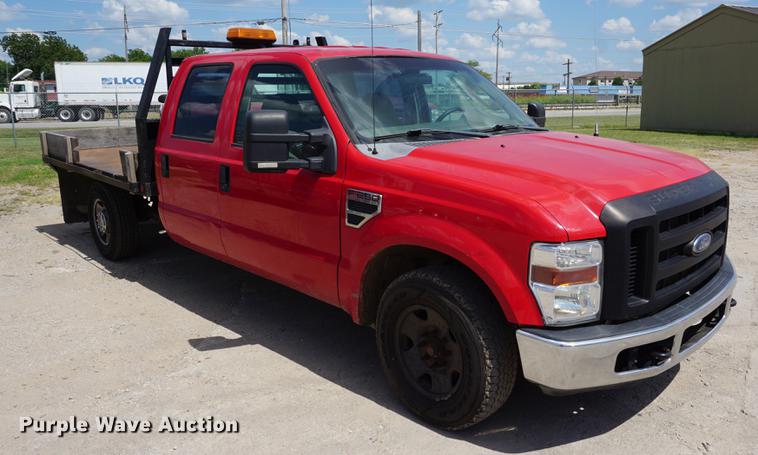 image for item DD7761 2008 Ford F250 Super Duty Crew Cab flatbed pickup truck