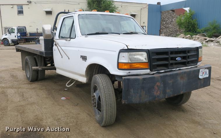 image for item DE3769 1996 Ford F350 Super Duty XLT flatbed pickup truck