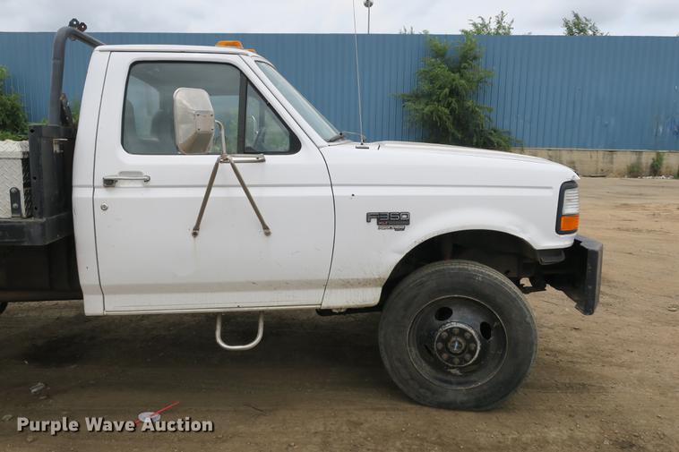 image for item DE3769 1996 Ford F350 Super Duty XLT flatbed pickup truck