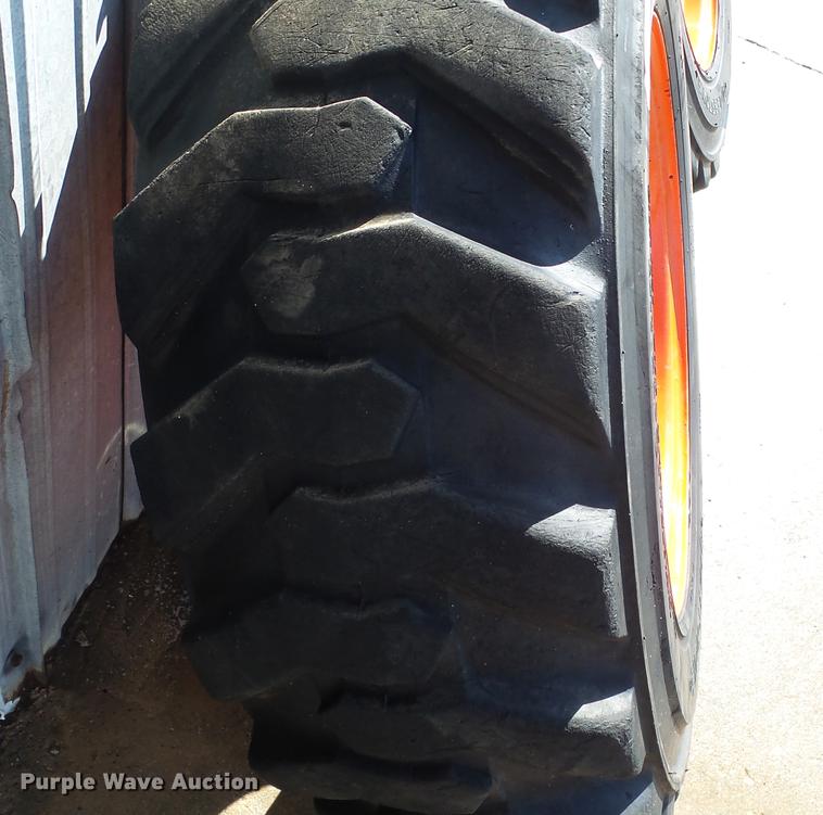 image for item EF9227 (4) 10-16.5 tires and wheels