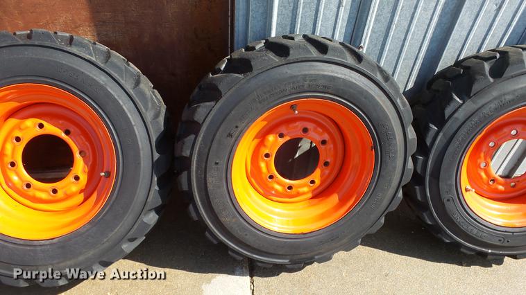 image for item EF9227 (4) 10-16.5 tires and wheels