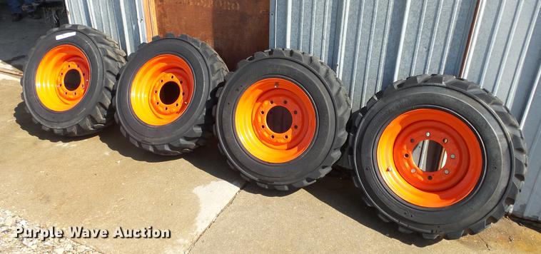 image for item EF9227 (4) 10-16.5 tires and wheels