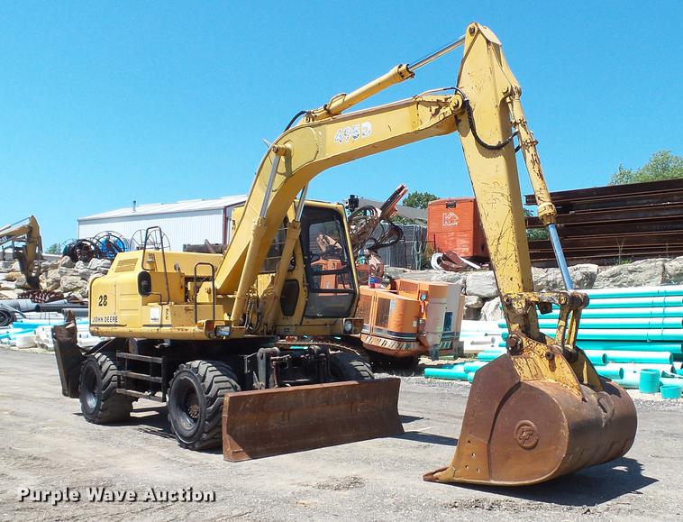 image for item DD7291 1989 John Deere 495D rubber tired excavator