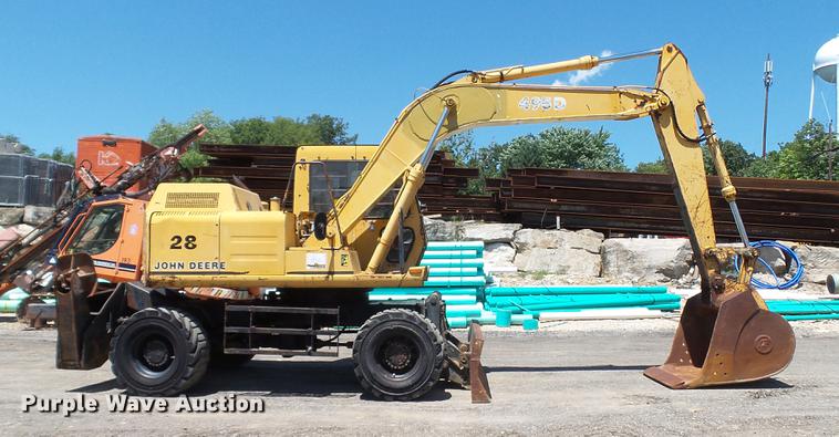 image for item DD7291 1989 John Deere 495D rubber tired excavator