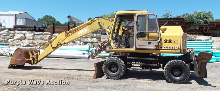 image for item DD7291 1989 John Deere 495D rubber tired excavator