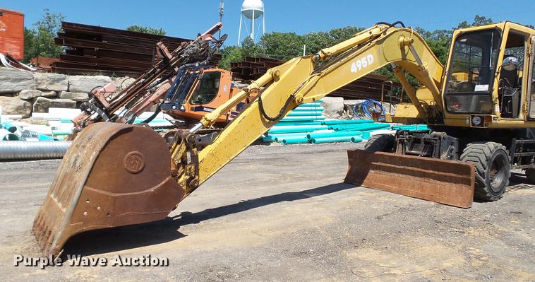 image for item DD7291 1989 John Deere 495D rubber tired excavator