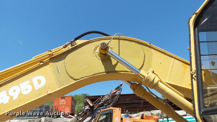 image for item DD7291 1989 John Deere 495D rubber tired excavator