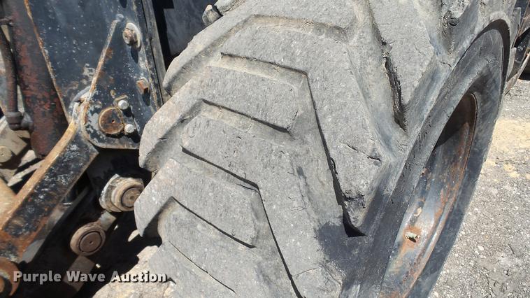 image for item DD7291 1989 John Deere 495D rubber tired excavator
