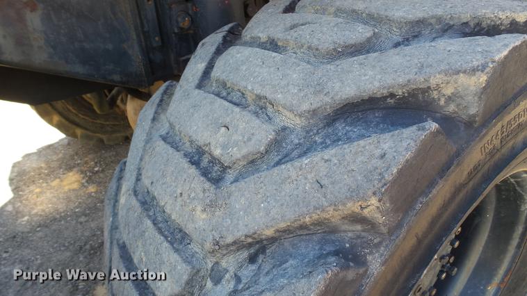 image for item DD7291 1989 John Deere 495D rubber tired excavator