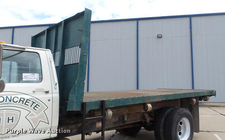 image for item DD7314 1995 Ford F700 flat dump bed truck