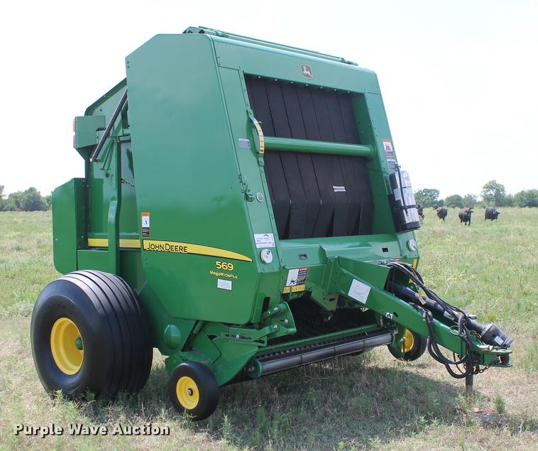 image for item DD5237 2015 John Deere 569 Mega Wide Plus round baler