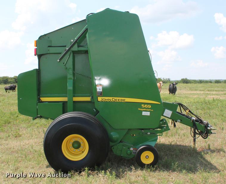 image for item DD5237 2015 John Deere 569 Mega Wide Plus round baler