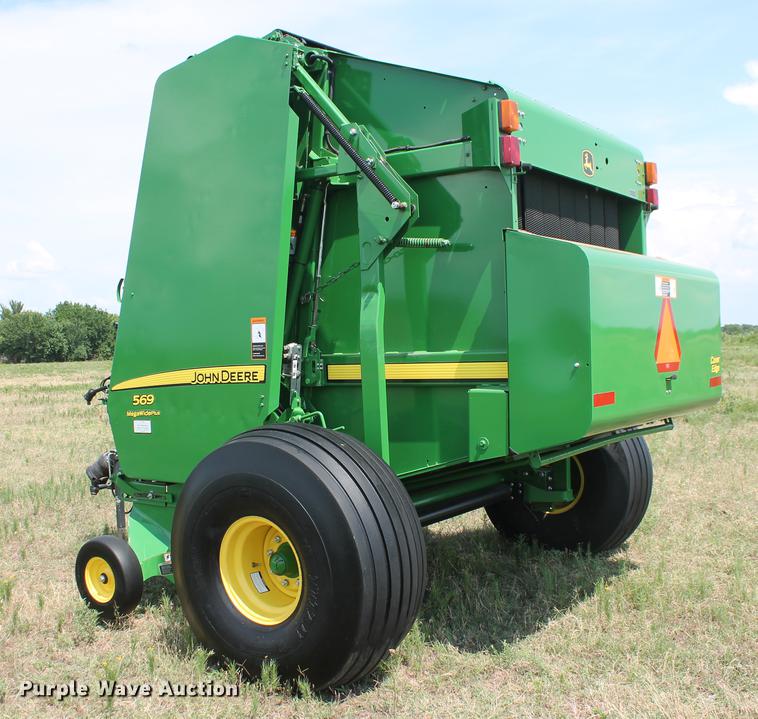 image for item DD5237 2015 John Deere 569 Mega Wide Plus round baler
