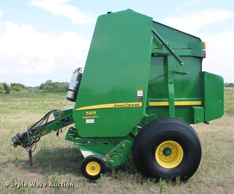 image for item DD5237 2015 John Deere 569 Mega Wide Plus round baler