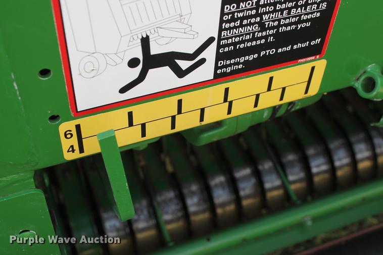 image for item DD5237 2015 John Deere 569 Mega Wide Plus round baler