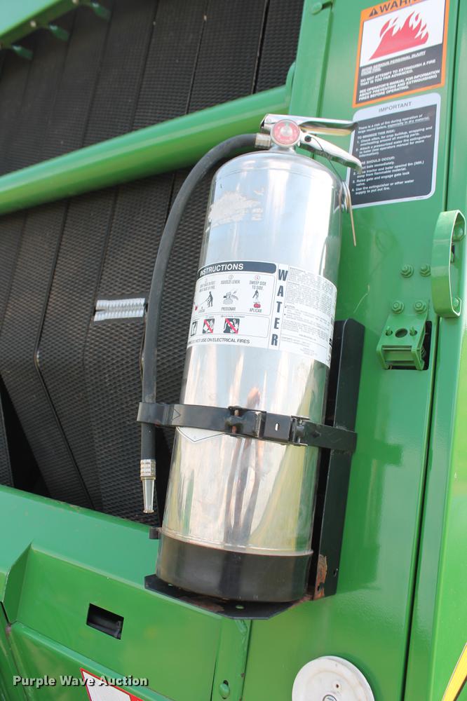 image for item DD5237 2015 John Deere 569 Mega Wide Plus round baler