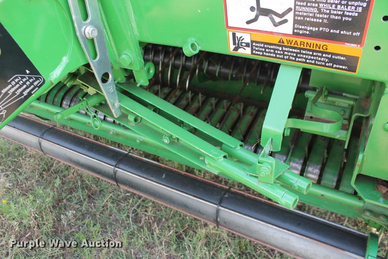 image for item DD5237 2015 John Deere 569 Mega Wide Plus round baler