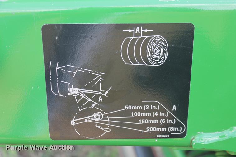 image for item DD5237 2015 John Deere 569 Mega Wide Plus round baler