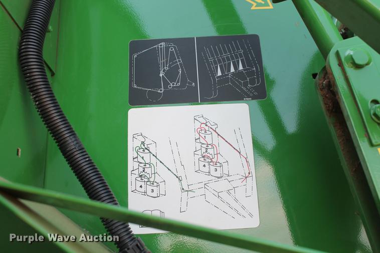 image for item DD5237 2015 John Deere 569 Mega Wide Plus round baler