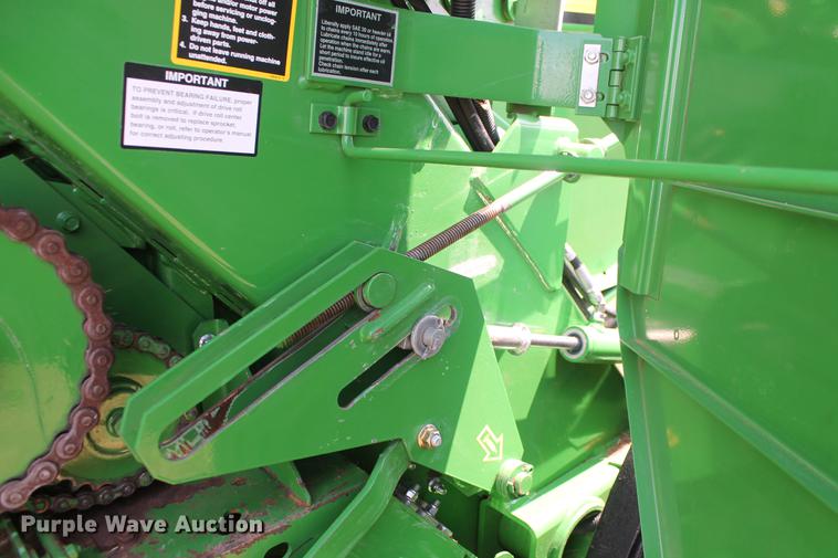 image for item DD5237 2015 John Deere 569 Mega Wide Plus round baler