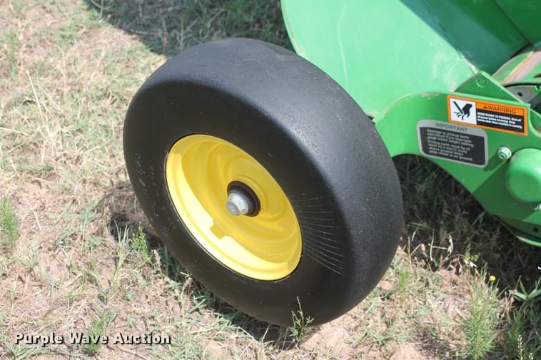 image for item DD5237 2015 John Deere 569 Mega Wide Plus round baler