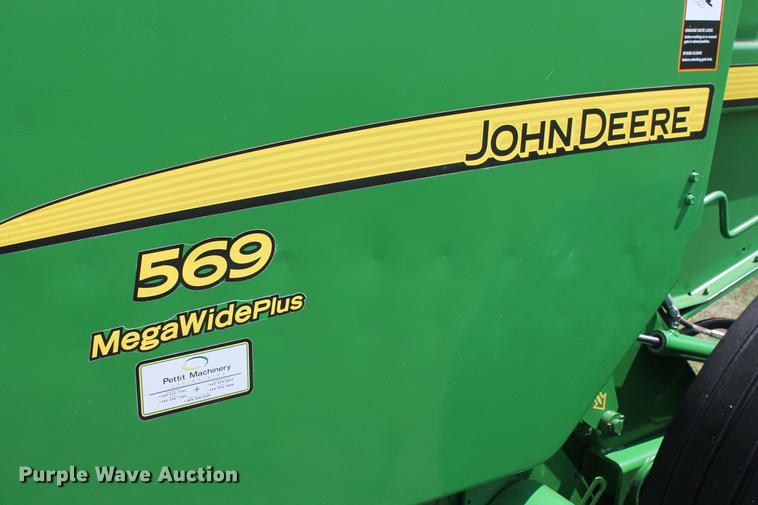 image for item DD5237 2015 John Deere 569 Mega Wide Plus round baler