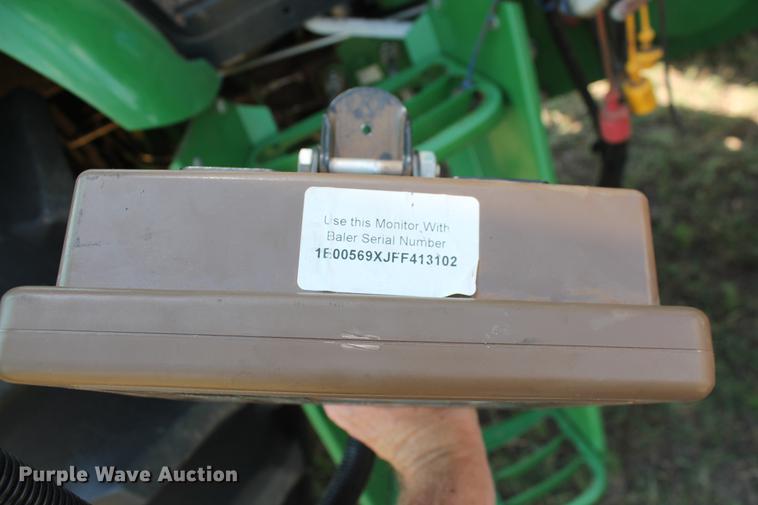 image for item DD5237 2015 John Deere 569 Mega Wide Plus round baler