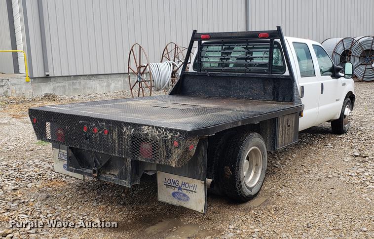 image for item DF2408 2006 Ford F350 Super Duty Crew Cab flatbed pickup truck
